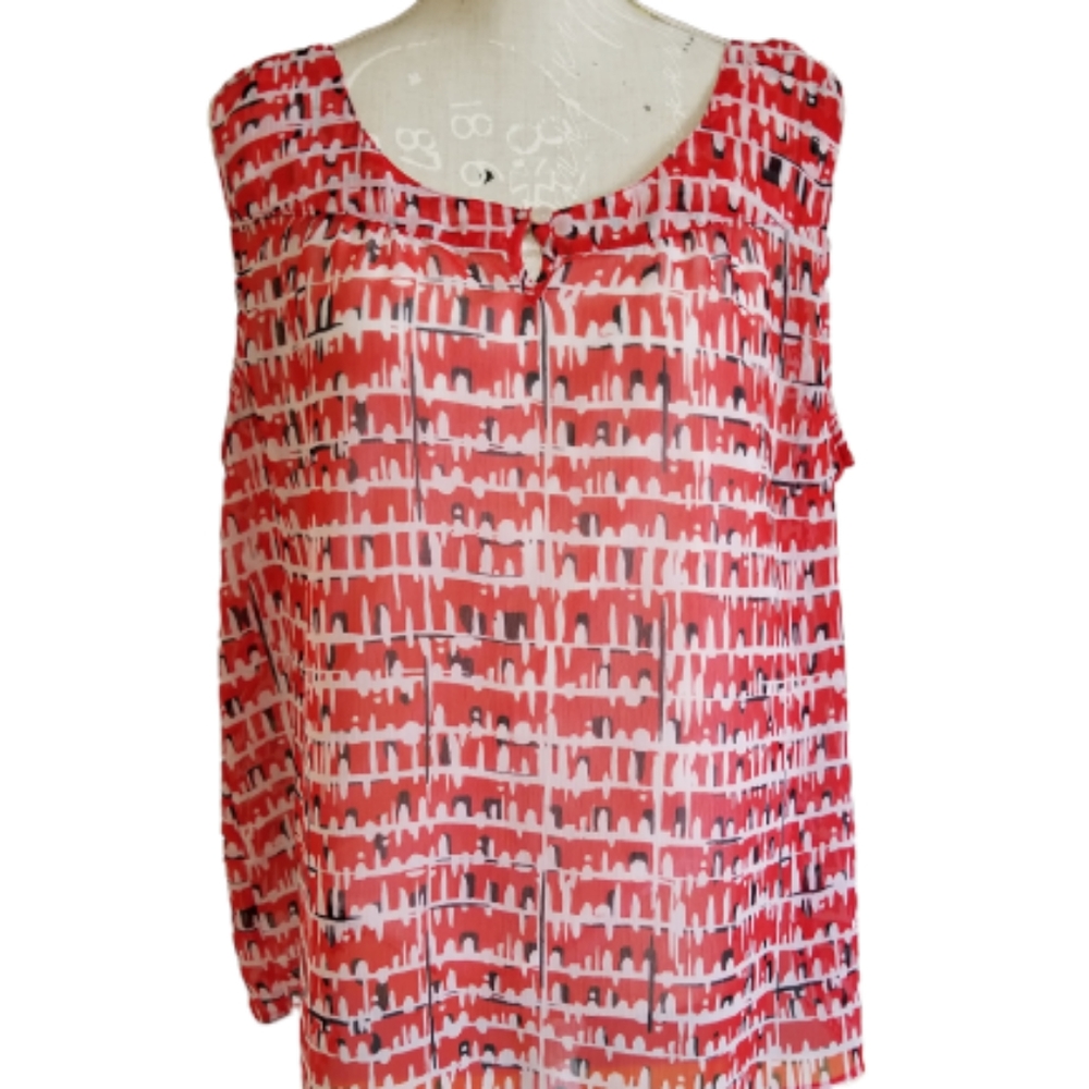 Cute sleeveless shirt with attached white camisole